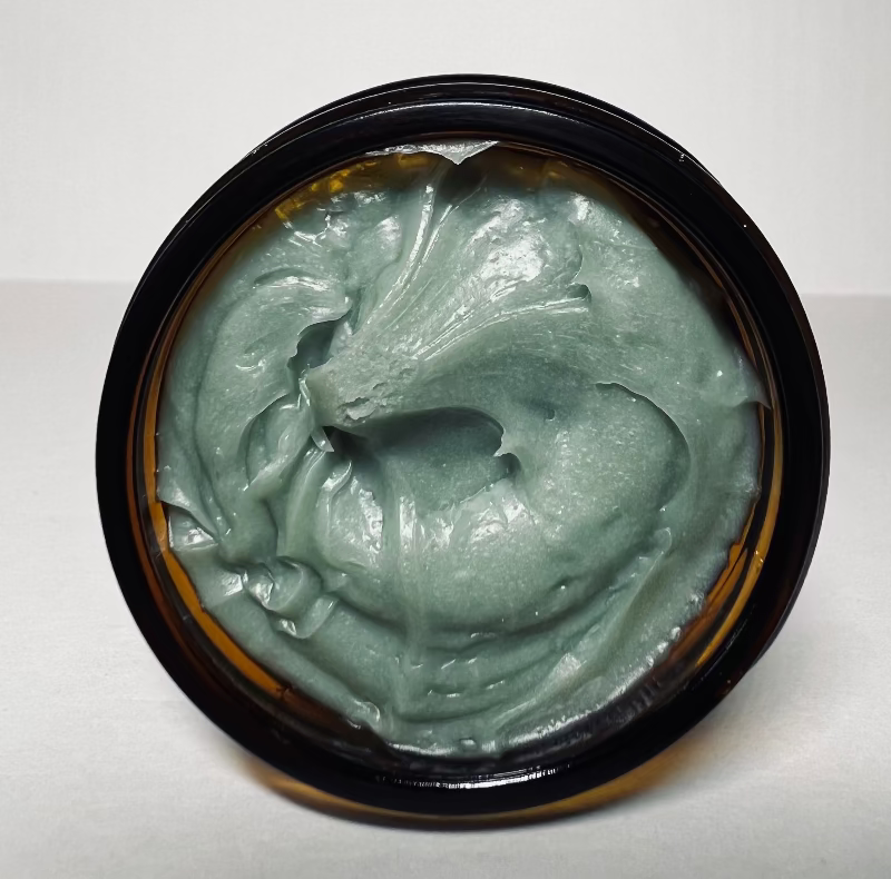 Top-down view of the grass-fed beef tallow Healing Balm in its open jar.